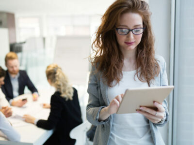 Elegant smart businesswoman in company office